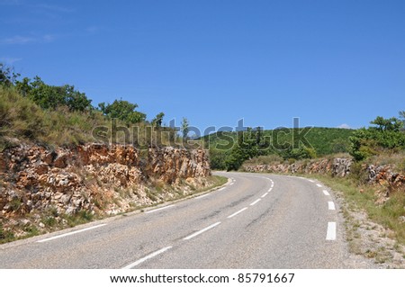 asphalt road with rocky roadside in Provence-Alpes-Cote d\'Azur region, France