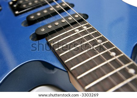 Blue guitar on white background, focus in the middle