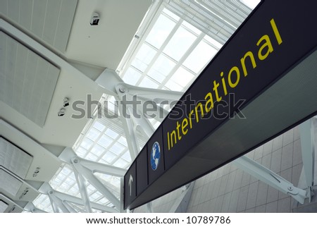 A sign above the international departure gate at a new terminal in a major North American airport.