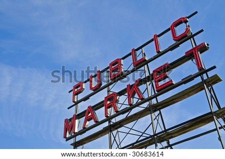 A red neon Public Market sign at the Pike Street Market in Seattle, Washington, USA.
