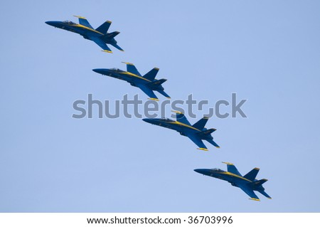 TORONTO, ON - SEPTEMBER 7: Four F/A18 Hornets from the US Navy Blue Angels Flight Demonstration Squadron in formation over the city on the last day of the air show, September 7, 2009 in Toronto, ON.
