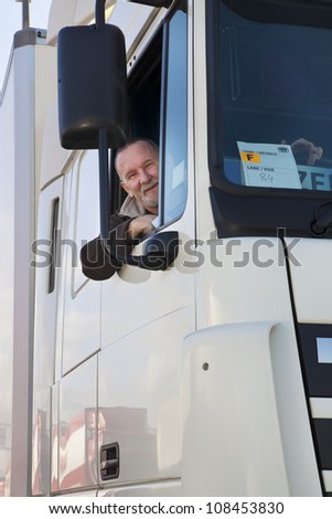 Truck driver and his truck - close up
