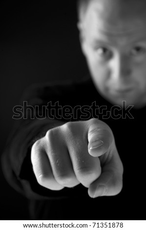 mid-aged man pointing You with forefinger