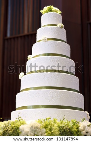 Wedding cake decorate with flower on table in wedding party