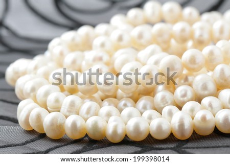 Pearl necklace against a dark background