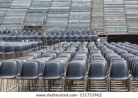 Empty chairs in an open air arena for a festival in Florence