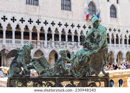Open brass sculpture on the gate to the Campanile in Venice on San Marco square opposite the doge\'s palace