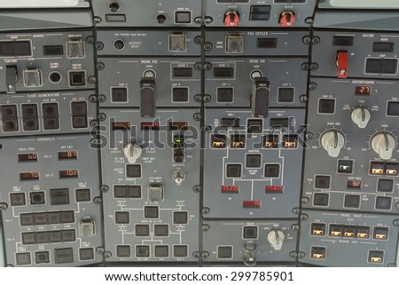 An overhead control panel in an old and smaller commercial plane
