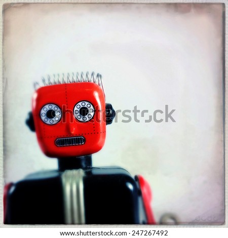 Instagram filtered image of a vintage toy robot