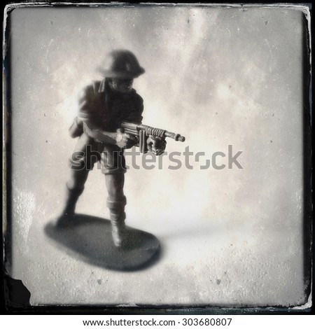 Vintage style Toy Soldier with an Instagram style grain filter - blurred focus