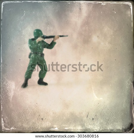 Vintage style Toy Soldier with an Instagram style grain filter - blurred focus