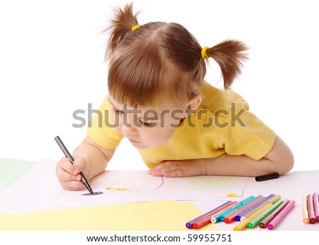 Cute child draws with color felt-tip pens, isolated over white