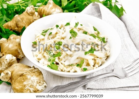 Similar – Image, Stock Photo Plate with raw Jerusalem artichoke on concrete kitchen table with olive oil, herbs and spices. Cooking preparation at home with root vegetable. Top view.