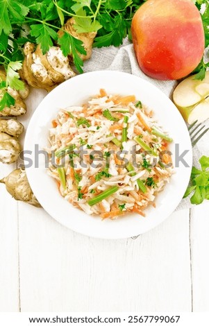 Similar – Image, Stock Photo Plate with raw Jerusalem artichoke on concrete kitchen table with olive oil, herbs and spices. Cooking preparation at home with root vegetable. Top view.