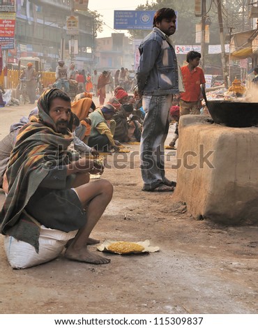 VARANASI, INDIA - NOV 24: People eating in \