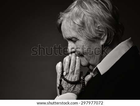 Praying senior woman. MANY OTHER PHOTOS FROM THIS SERIES IN MY PORTFOLIO.