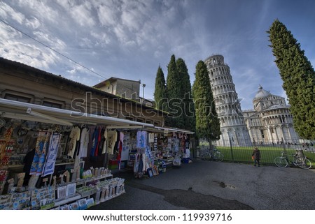 PISA, ITALY - NOV 24: Street seller in front of Miracles Square, November 24, 2012 in Pisa, Italy. City administration has a plan to remove these stalls around the famous landmark
