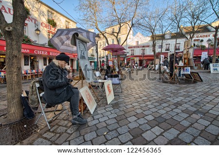 PARIS - DEC 2: The charming streets of Montmartre hill, December 2, 2012 in Paris. The quarter is full of art galleries, cafes and shops to walk about. It\'s one of the most visited landmarks in Paris