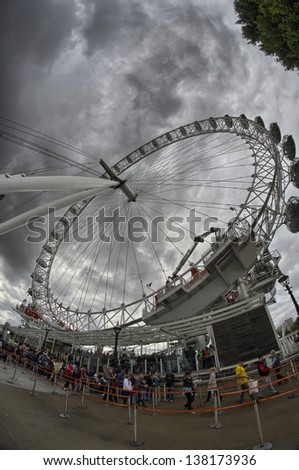 LONDON, SEP 27: People stand the queue at the base of London Eye, September 27 in London. London Eye is the tallest Ferris wheel in Europe at 135 meters