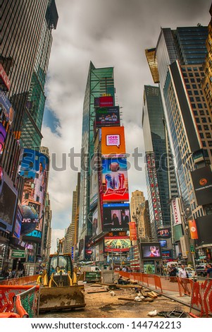 NEW YORK CITY - JUN 12: Advertisements on Times Square Buildings on June 12, 2013 in NYC. Times Square is the most visited tourist attraction in the world with over 39 million visitors annually