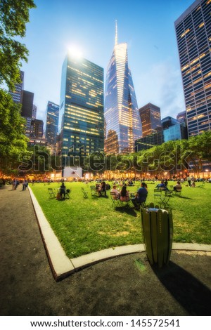 NEW YORK CITY - JUN 8: People relax in Bryant park in the evening, June 8, 2013 in NYC. Bryant Park is a 9,603 acre privately managed park in the center of Manhattan