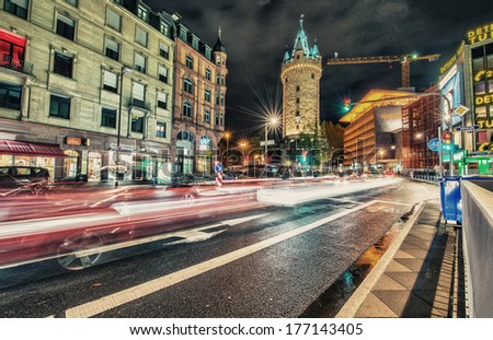 FRANKFURT - OCT 30, 2013: City lights at night with car light trails. Frankfurt is the largest financial centre in continental Europe and ranks among the world\'s leading financial centres.