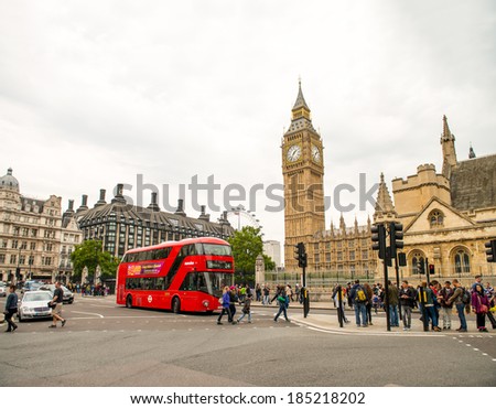 LONDON - SEP 28, 2013: Red Double Decker Bus near Westminster Palace. The \