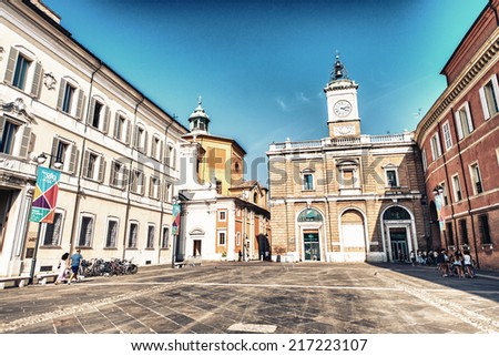 RAVENNA, ITALY - SEPTEMBER 9, 2014: Tourists walk in Piazza del Popolo. The city defined by UNESCO heritage of humanity has 3 million tourists per year.