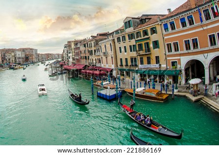 Grand Canal with Venice cityscape and tourists. All recognizable faces blurred.