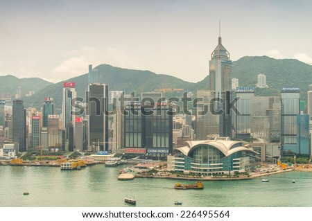 HONG KONG - MAY 11, 2014: City skyline with modern skyscrapers. With a population of over seven million people, Hong Kong is one of the most densely populated areas in the world.