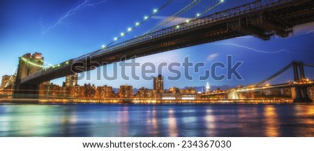 Night sky above Brooklyn Bridge and Manhattan Bridge - New York City.