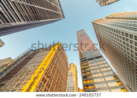 Downtown Manhattan skyscrapers as seen from street level.