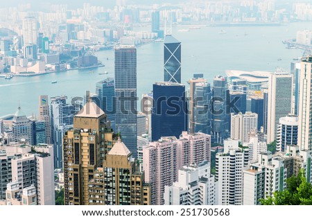 HONG KONG - MAY 11, 2014: City skyline with modern skyscrapers. With a population of over seven million people, Hong Kong is one of the most densely populated areas in the world.