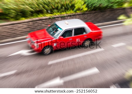 Blurred picture of Taxi speeding up in Hong Kong.