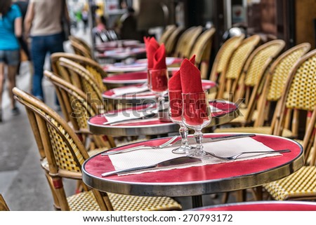 Montmartre restaurant with people walking.