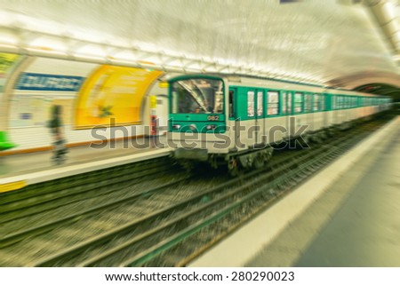 Blurred view of Metro station and train in Paris.