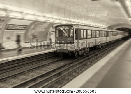 Blurred view of Metro station and train in Paris.