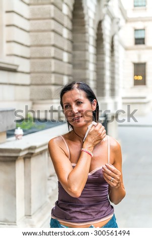 Woman sweating while visiting city.