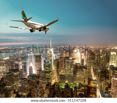 Airplane landing at night in New York City.