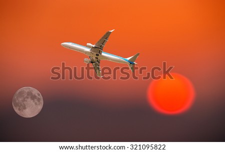 Airplane traveling between sun and moon.