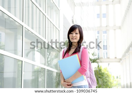 College Student standing outside college building