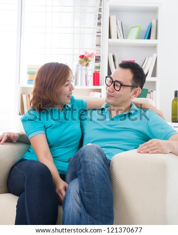 asian couple chatting	in a conversation