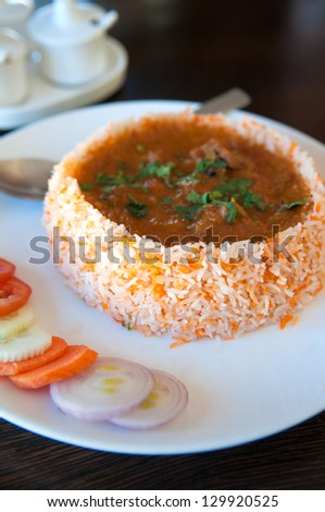 traditional famous Indian meal with biryani and curry