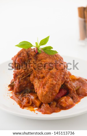 curry chicken rendang cooked in indian style with spicy sauce and chilli