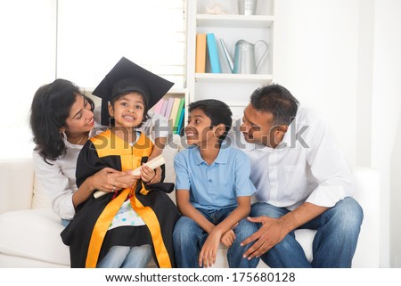 Happy indian family graduation, education concept photo