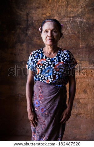 old asian senior woman in traditional clothes and tanaka