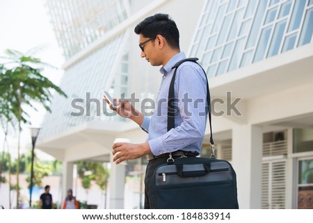 indian business male on a phone