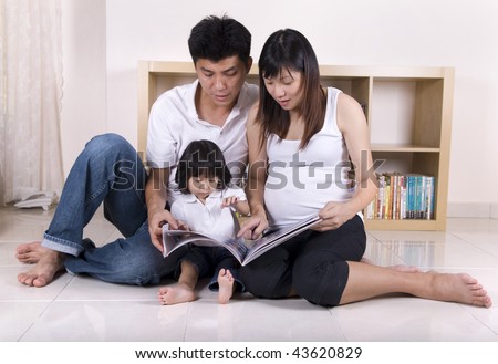 asian family learning in living room