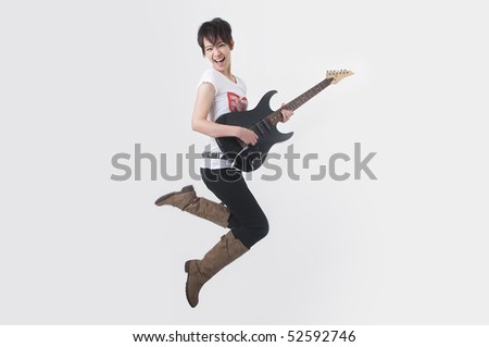 asian rock star girl jumping in action