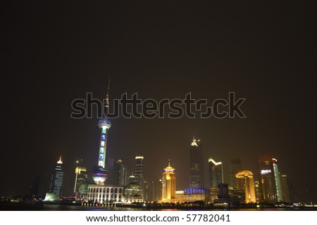 urban night view of shanghai city from pudong with a lot of empty spaces for advertising purpose